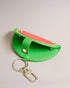 WMELON-Gifts-The WMELON set includes a faux leather watermelon keyring and vibrant card holder, perfect for adding a pop of colour to your everyday essentials. The keyring is shaped like a watermelon slice while the card holder features a sleek and simple design.The shell of this product is made with 52% recycled polyurethane. Using recycled polyurethane helps divert plastic waste from ending in landfills and helps us to reduce our dependency on virgin materials. Keyring and card holder set Watermelon desig